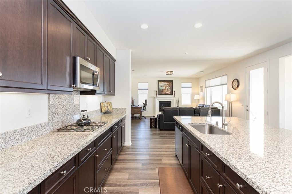 24125 Montecito Drive Wildomar, CA 92595 - Photo 4 of 25 a kitchen with granite countertop stainless steel appliances lots of counter top space