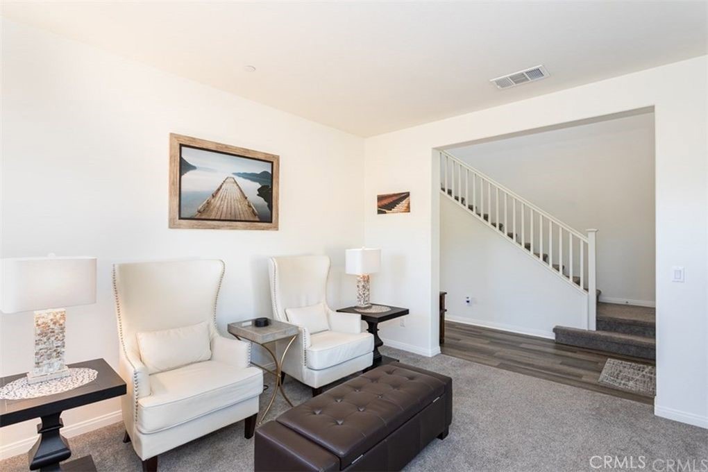 24125 Montecito Drive Wildomar, CA 92595 - Photo 6 of 25 a living room with furniture and a wooden floor