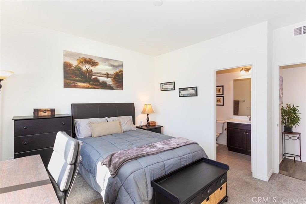 24125 Montecito Drive Wildomar, CA 92595 - Photo 7 of 25 a bedroom with a bed and a view of bathroom