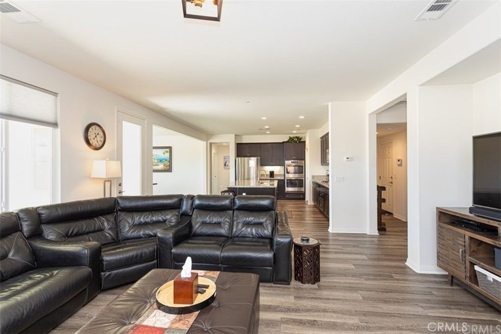 24125 Montecito Drive Wildomar, CA 92595 - Photo 9 of 25 a living room with furniture and a flat screen tv