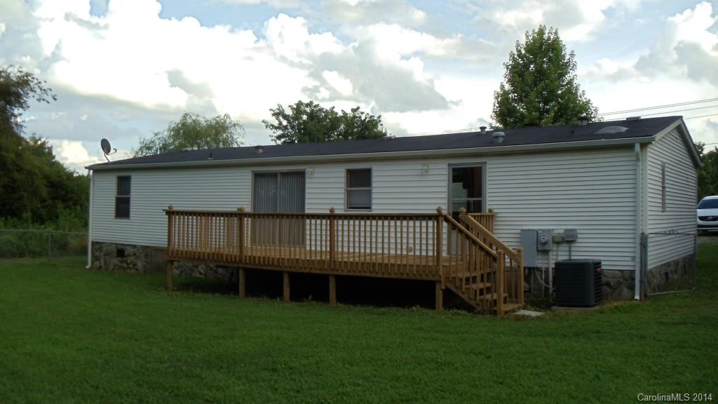 1766 North Ingleside Farm Road Iron Station, NC 28080 - Photo 20 of 23 a backyard of a house with wooden deck