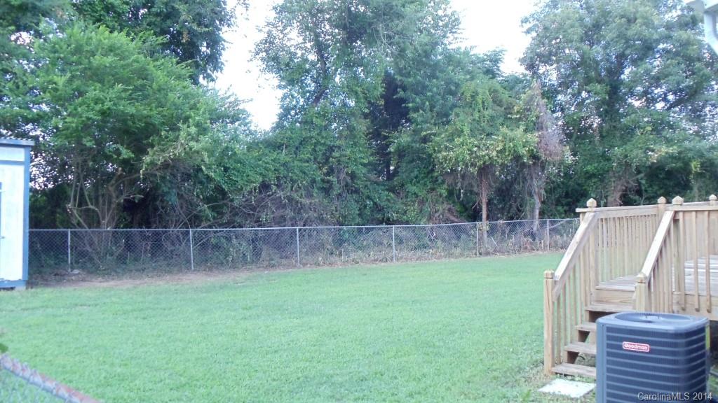 1766 North Ingleside Farm Road Iron Station, NC 28080 - Photo 22 of 23 a view of a backyard with small cabin
