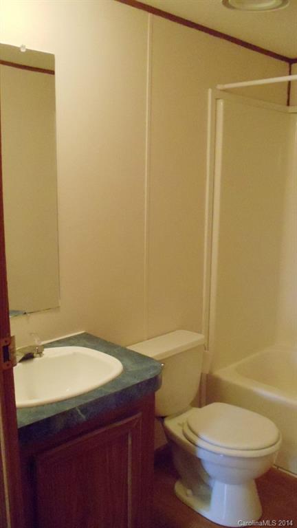 1766 North Ingleside Farm Road Iron Station, NC 28080 - Photo 6 of 23 a bathroom with a sink a toilet and shower