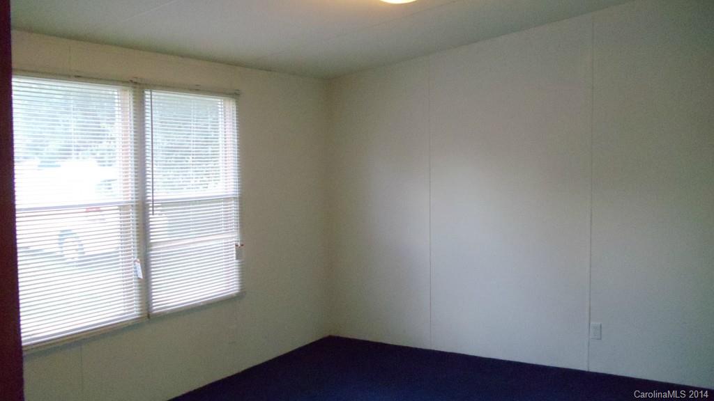 1766 North Ingleside Farm Road Iron Station, NC 28080 - Photo 9 of 23 an empty room with a window