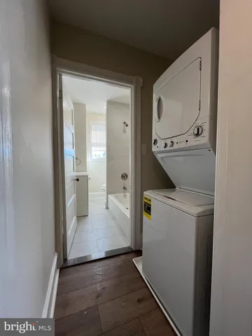 a view of bathroom with a sink mirror and toilet
