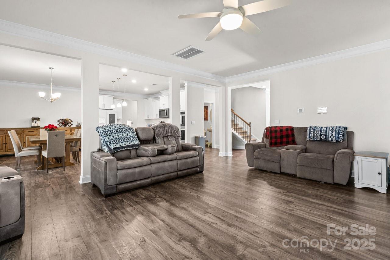 313 Streamwood Road Troutman, NC 28166 - Photo 11 of 48 a living room with furniture and a wooden floor