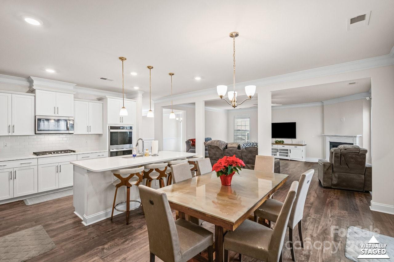 313 Streamwood Road Troutman, NC 28166 - Photo 15 of 48 a view of kitchen with cabinets table and chairs