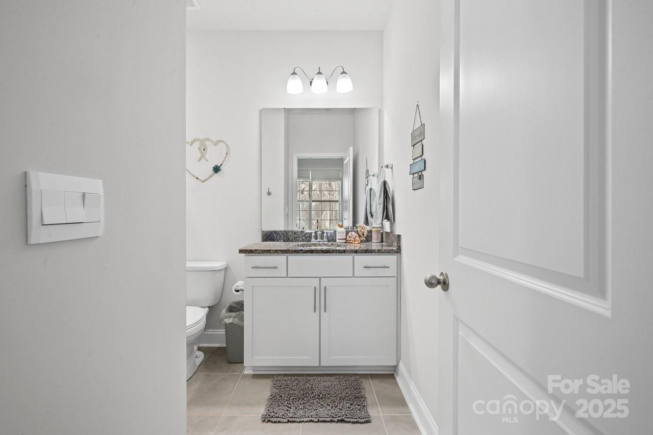 313 Streamwood Road Troutman, NC 28166 - Photo 22 of 48 a bathroom with a sink a toilet and shower