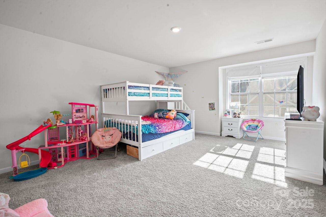 313 Streamwood Road Troutman, NC 28166 - Photo 27 of 48 a bedroom with furniture and a window