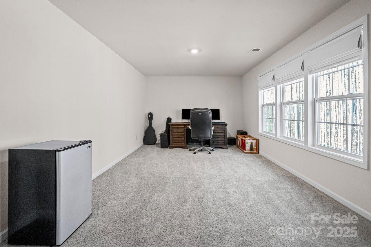 313 Streamwood Road Troutman, NC 28166 - Photo 37 of 48 a view of a livingroom with workspace and a window