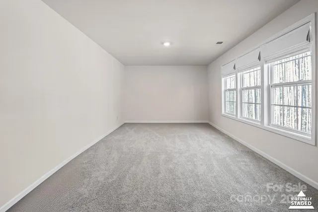 an empty room with a windows