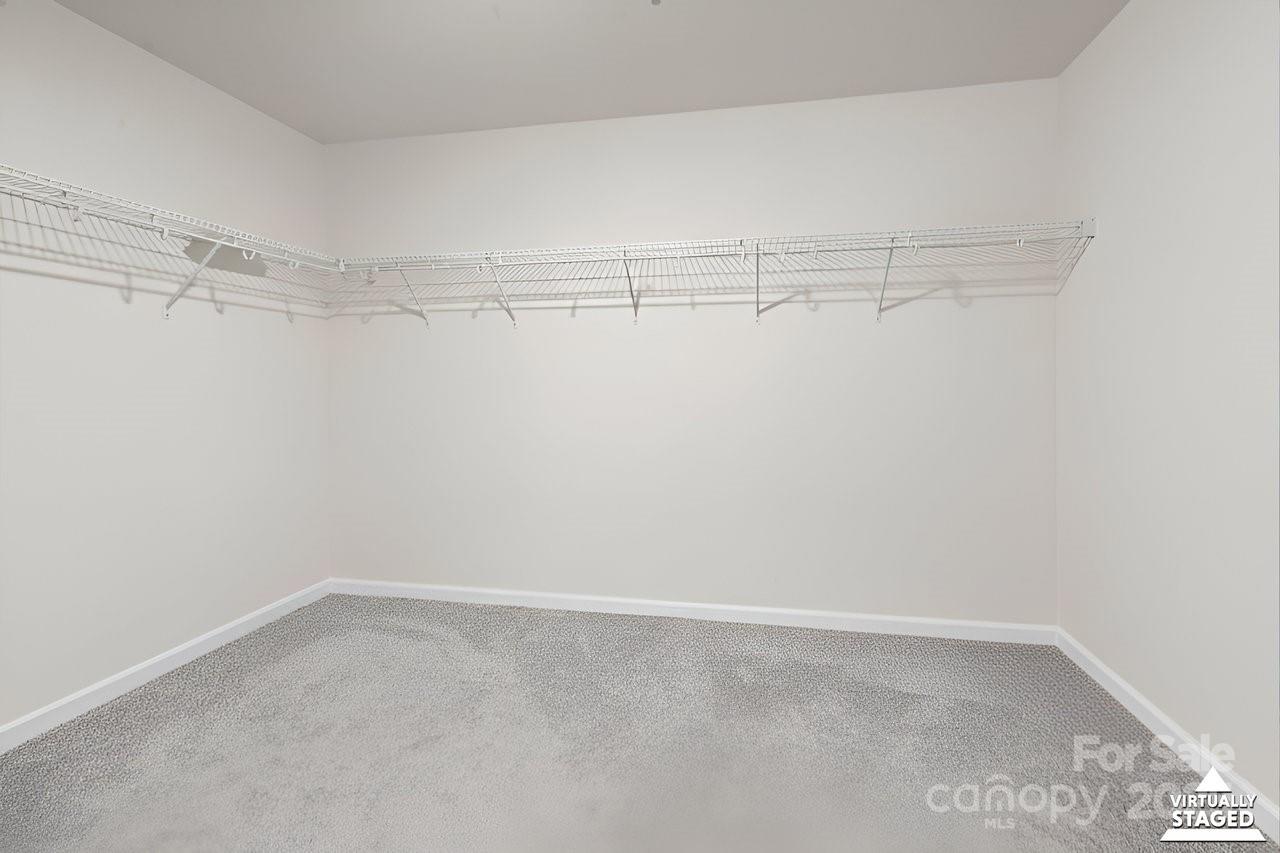 313 Streamwood Road Troutman, NC 28166 - Photo 40 of 48 a view of a room with racks on the wall