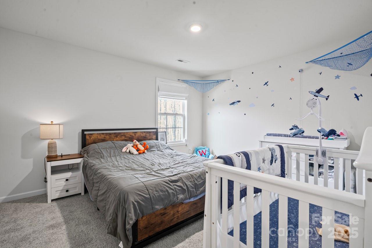 313 Streamwood Road Troutman, NC 28166 - Photo 41 of 48 a bedroom with furniture and a window