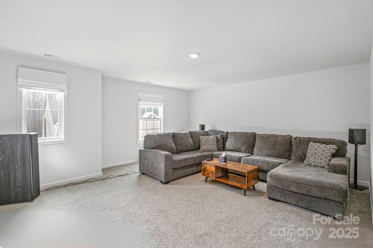 313 Streamwood Road Troutman, NC 28166 - Photo 44 of 48 a living room with furniture and a window