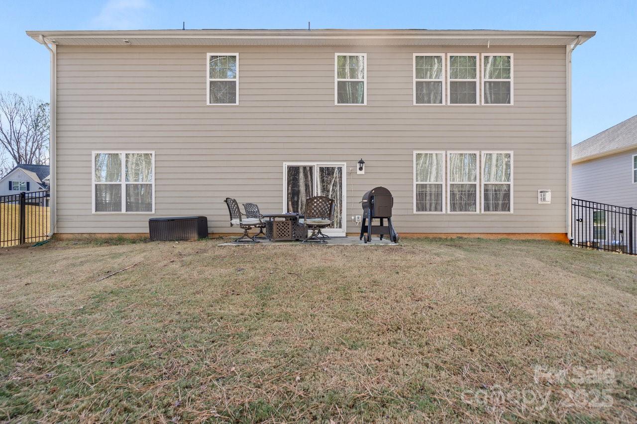 313 Streamwood Road Troutman, NC 28166 - Photo 46 of 48 a view of a house with many windows
