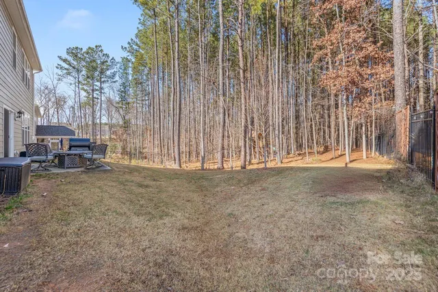 a view of outdoor space with wooden fence