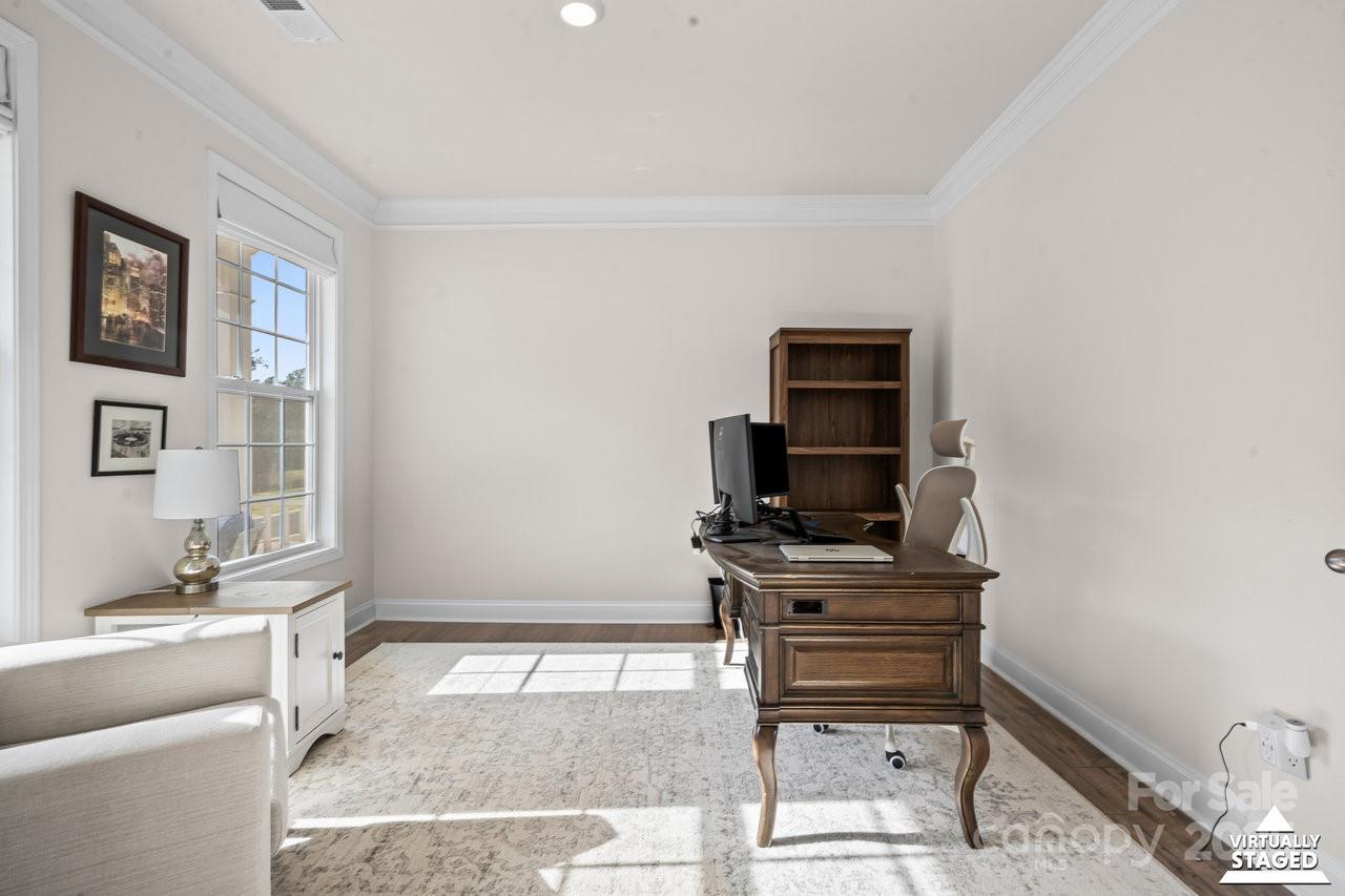 313 Streamwood Road Troutman, NC 28166 - Photo 6 of 48 a living room with furniture a piano and a flat screen tv