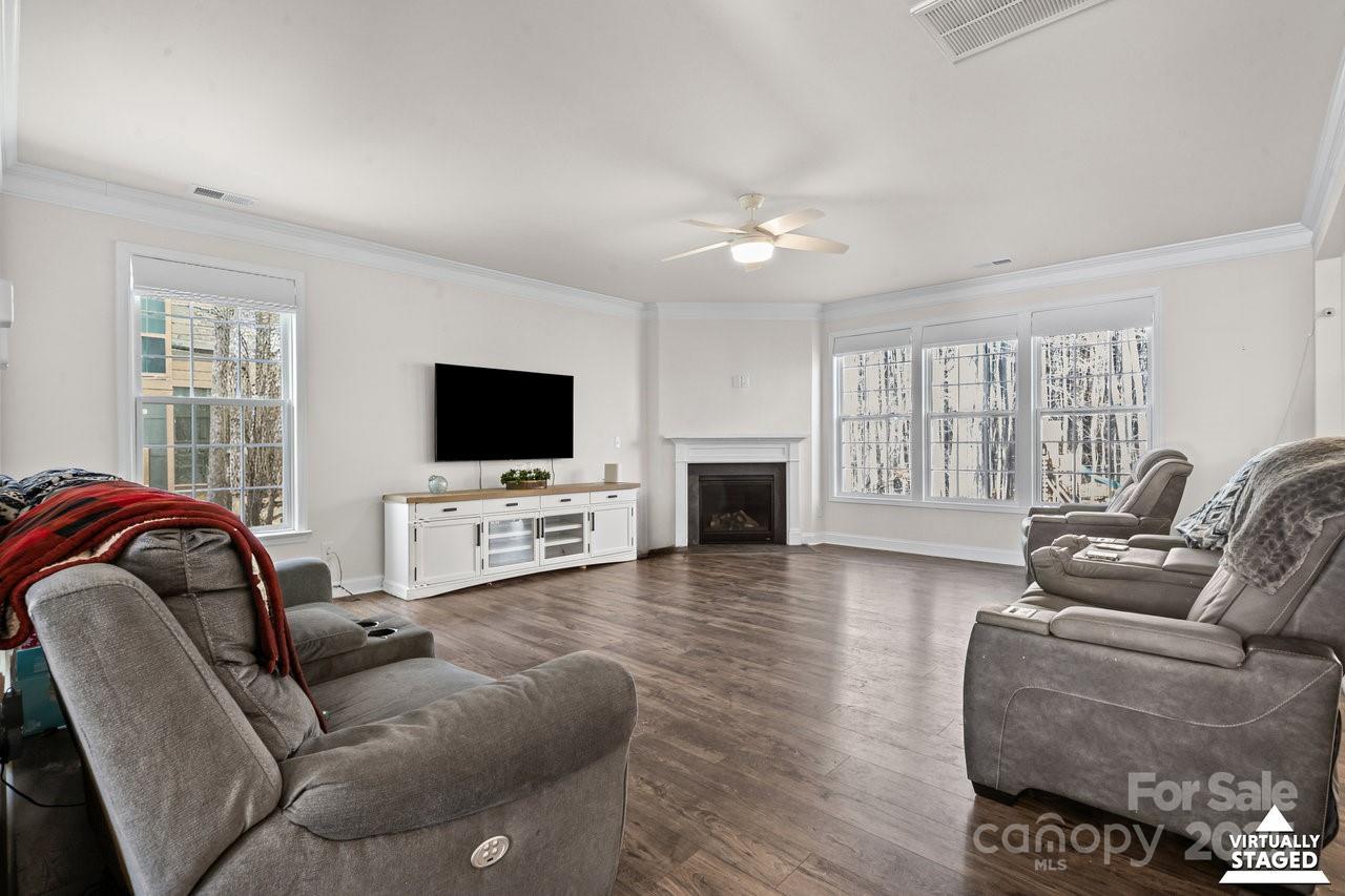 313 Streamwood Road Troutman, NC 28166 - Photo 9 of 48 a living room with furniture and a flat screen tv