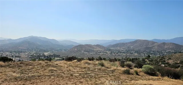 a view of a town with mountains in the background