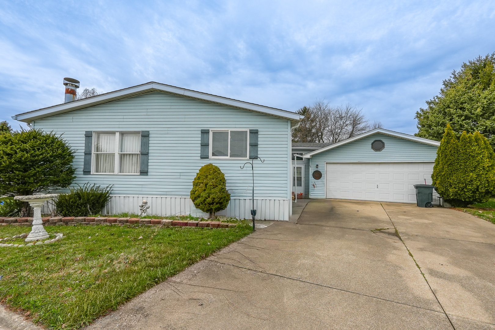 a view of house with backyard and entertaining space
