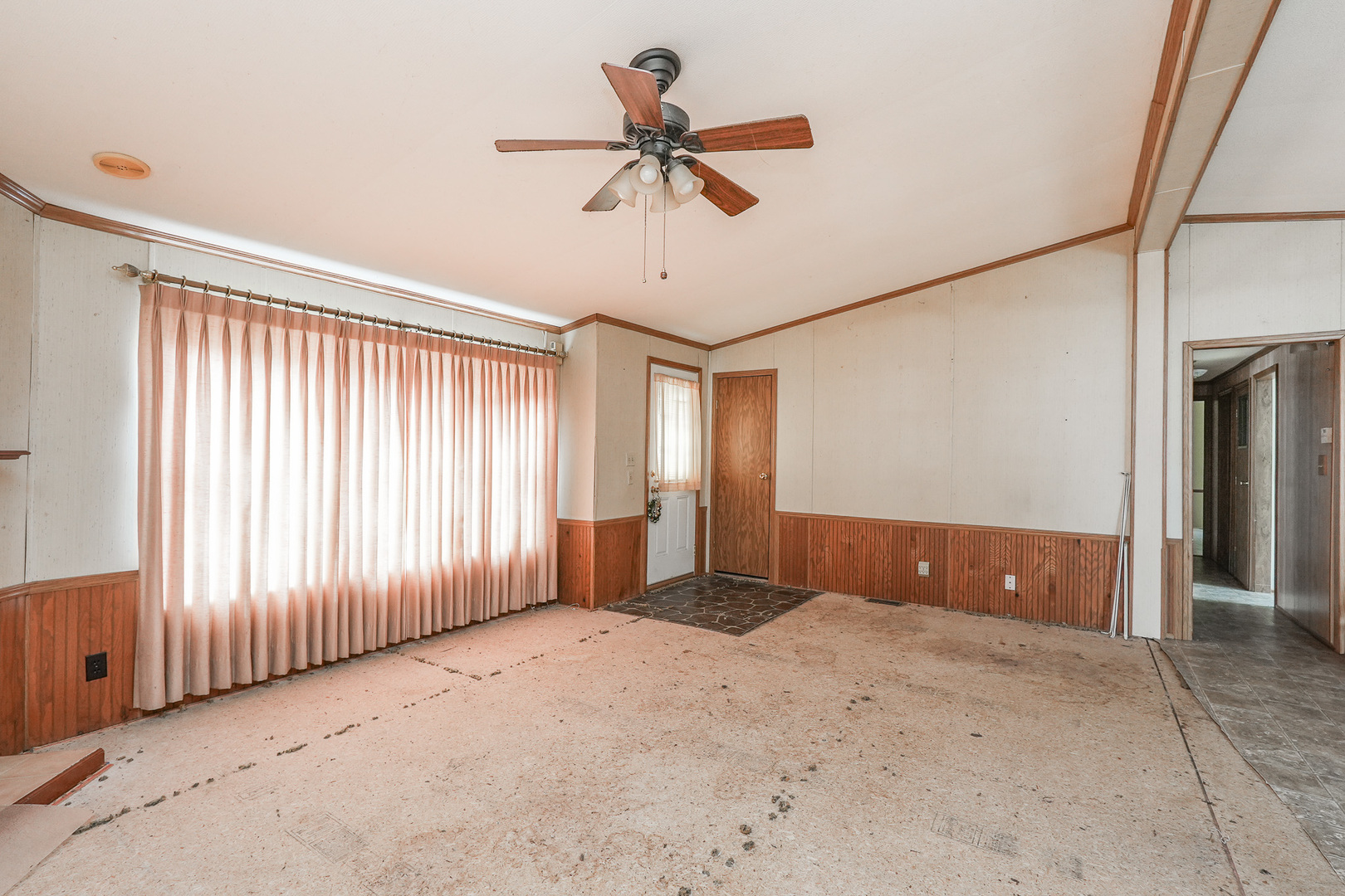 59 Maple Lane Manteno, IL 60950 - Photo 11 of 26 an empty room with ceiling fan and windows