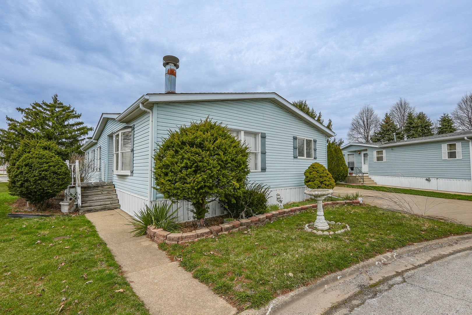 59 Maple Lane Manteno, IL 60950 - Photo 2 of 26 a front view of a house with garden