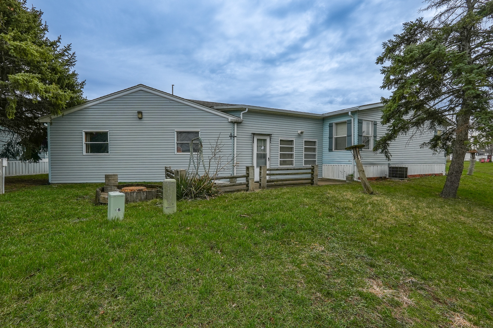 59 Maple Lane Manteno, IL 60950 - Photo 25 of 26 a backyard of a house with table and chairs