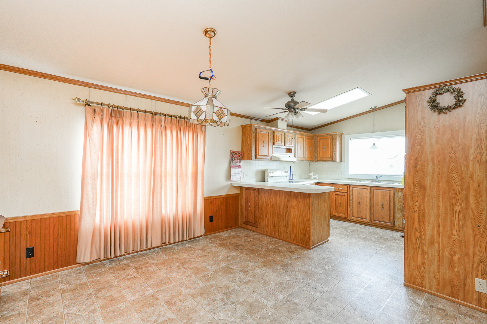 59 Maple Lane Manteno, IL 60950 - Photo 4 of 26 a view of a kitchen with a sink and cabinets