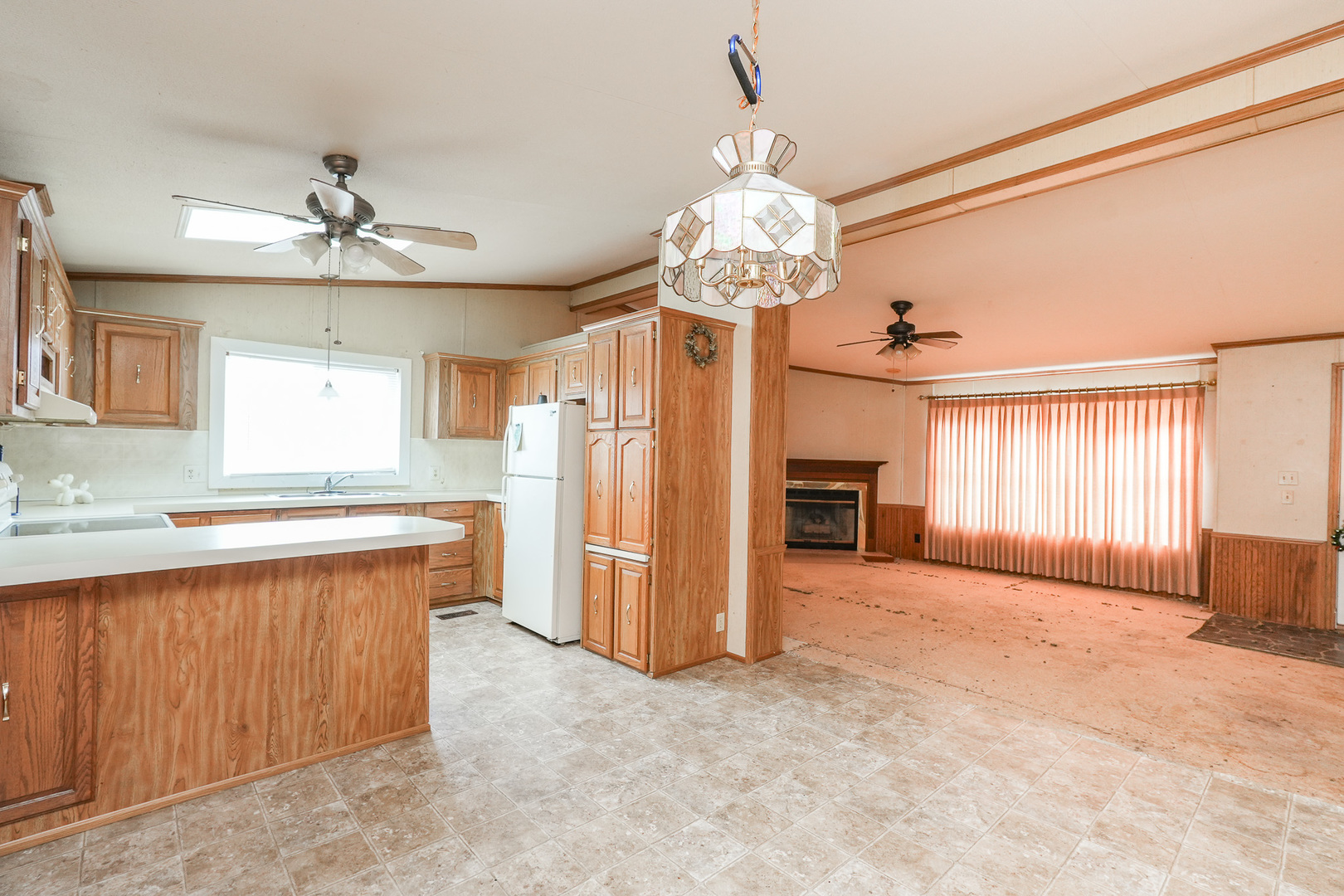 59 Maple Lane Manteno, IL 60950 - Photo 5 of 26 a view of a kitchen with a sink and refrigerator