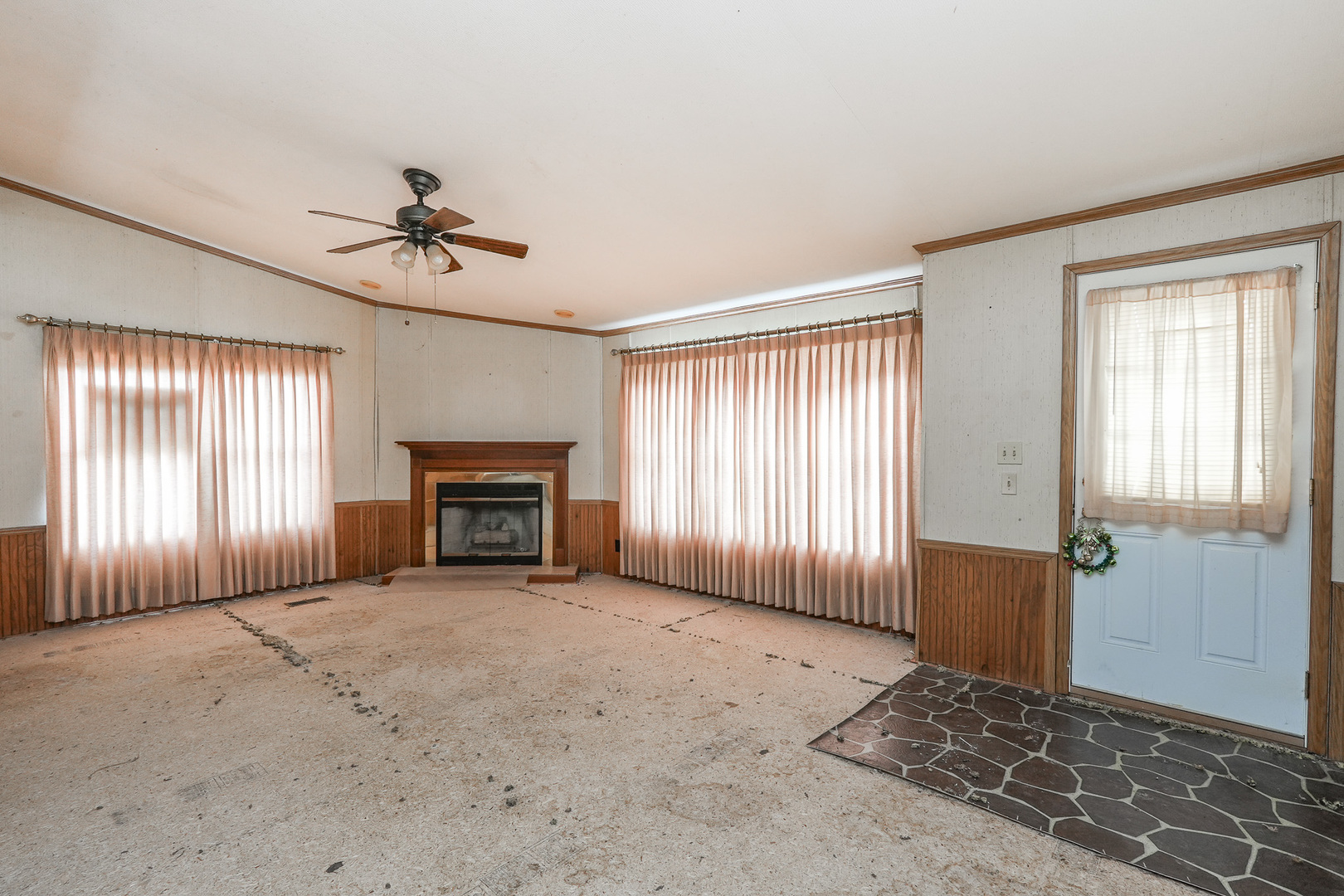 59 Maple Lane Manteno, IL 60950 - Photo 8 of 26 a view of empty room with windows and fireplace