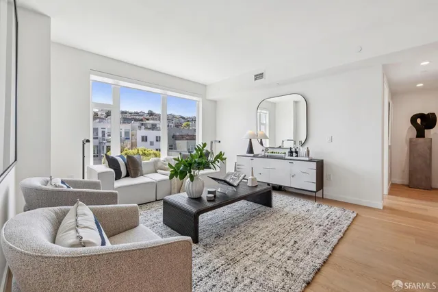 a living room with furniture and a rug