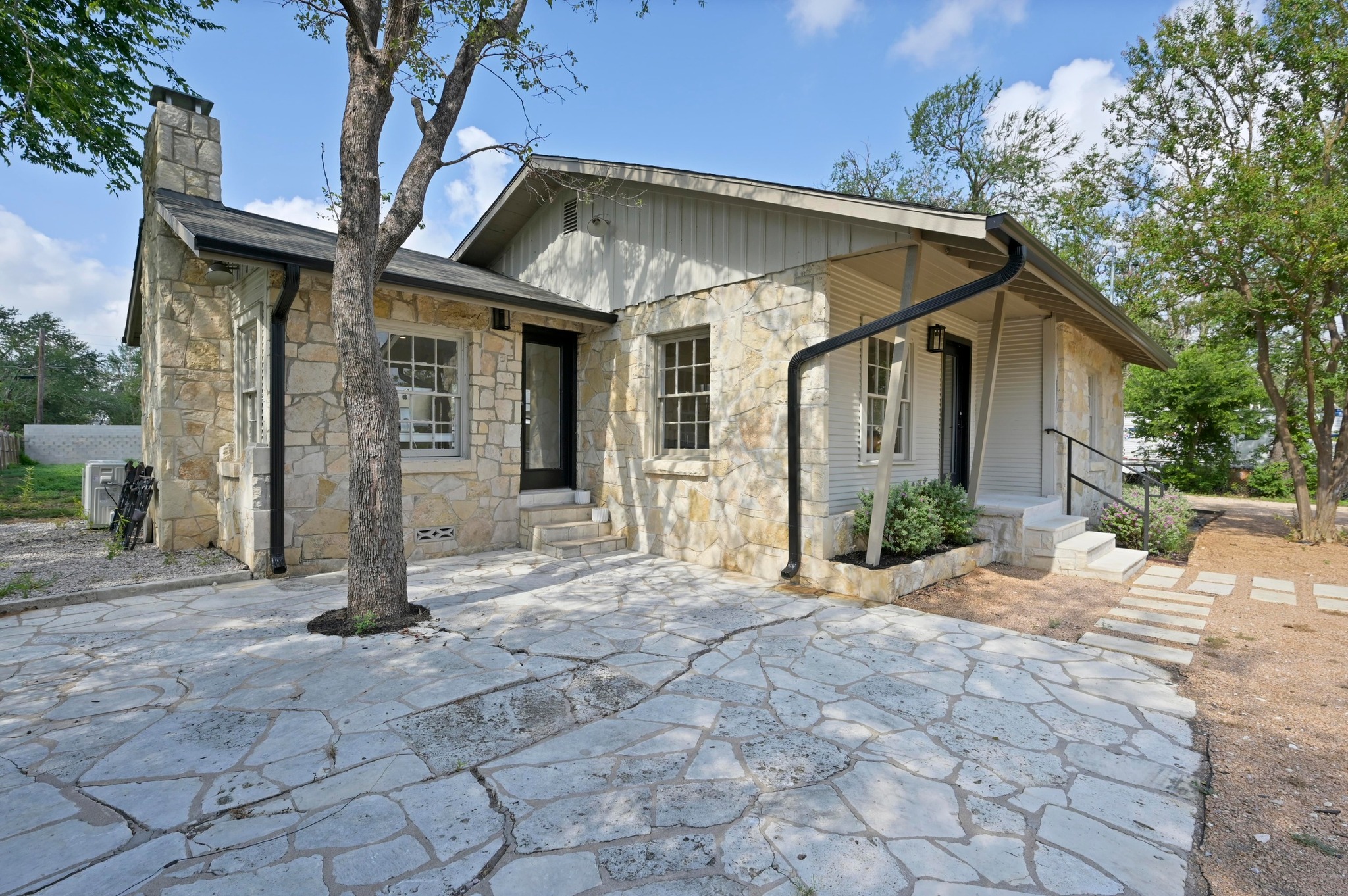 3501 Pecan Springs Road Austin, TX 78723 - Photo 6 of 40 View of front of home featuring a chimney and stone siding