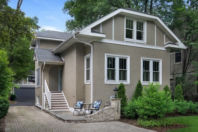 228 North County Line Road Hinsdale, IL 60521 - Photo 1 of 1 a front view of a house with a yard