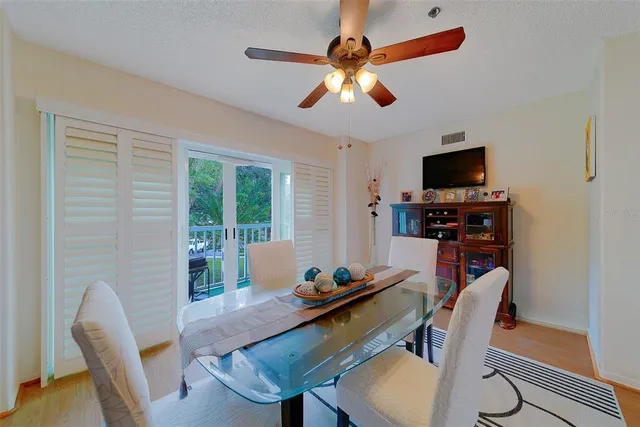 a bedroom with a bed and a tv on the dresser