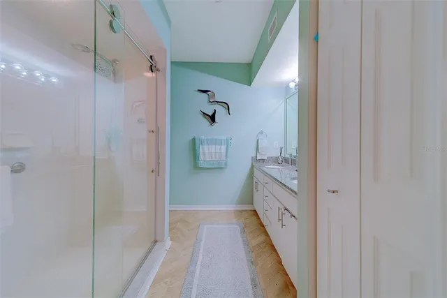 a bedroom with a bed and a table