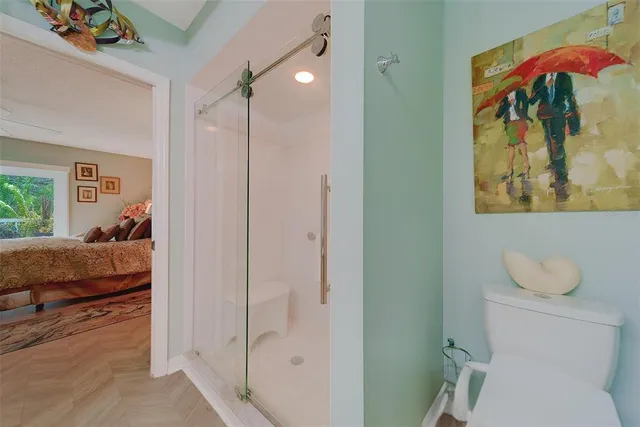 a bathroom with a sink a toilet and a shower curtain