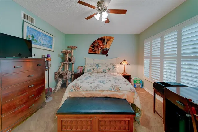 a view of a brick house with a large window