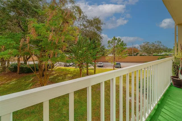 an aerial view of a city with lots of residential buildings ocean and mountain view in back