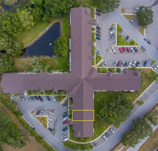 an aerial view of house with yard swimming pool and outdoor seating