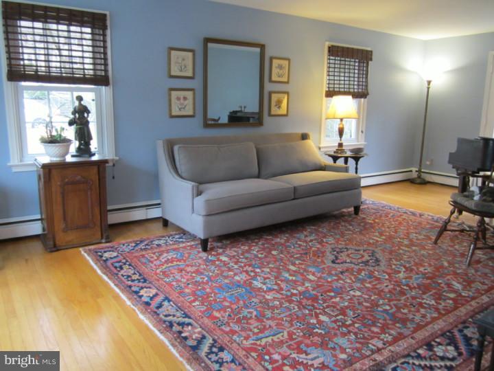 204 Beatty Road Media, PA 19063 - Photo 4 of 19 a living room with furniture and a rug