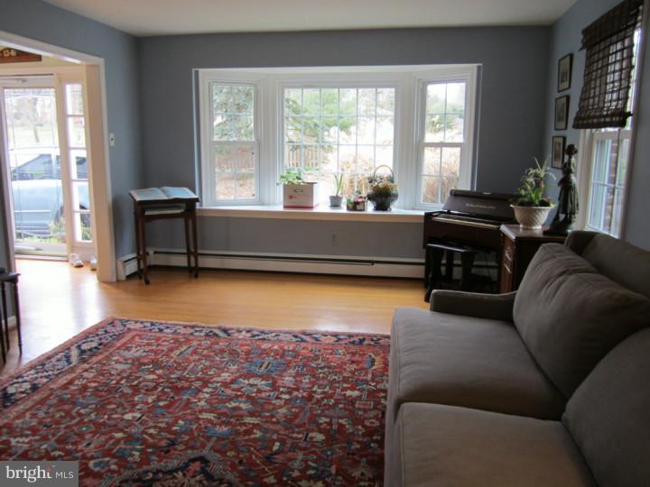 204 Beatty Road Media, PA 19063 - Photo 5 of 19 a living room with furniture and a flat screen tv
