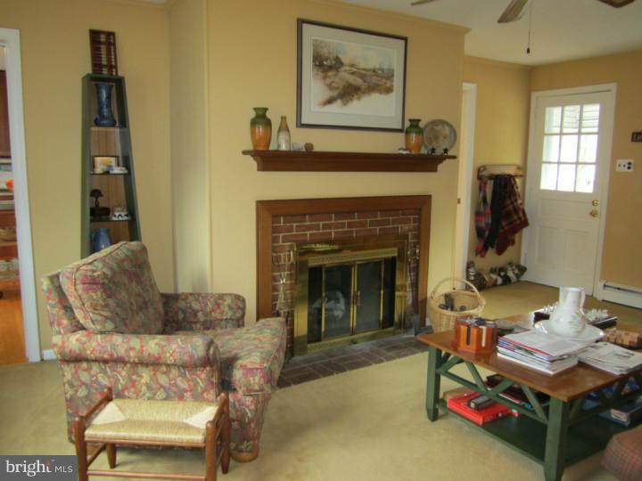 204 Beatty Road Media, PA 19063 - Photo 9 of 19 a living room with furniture and a fireplace