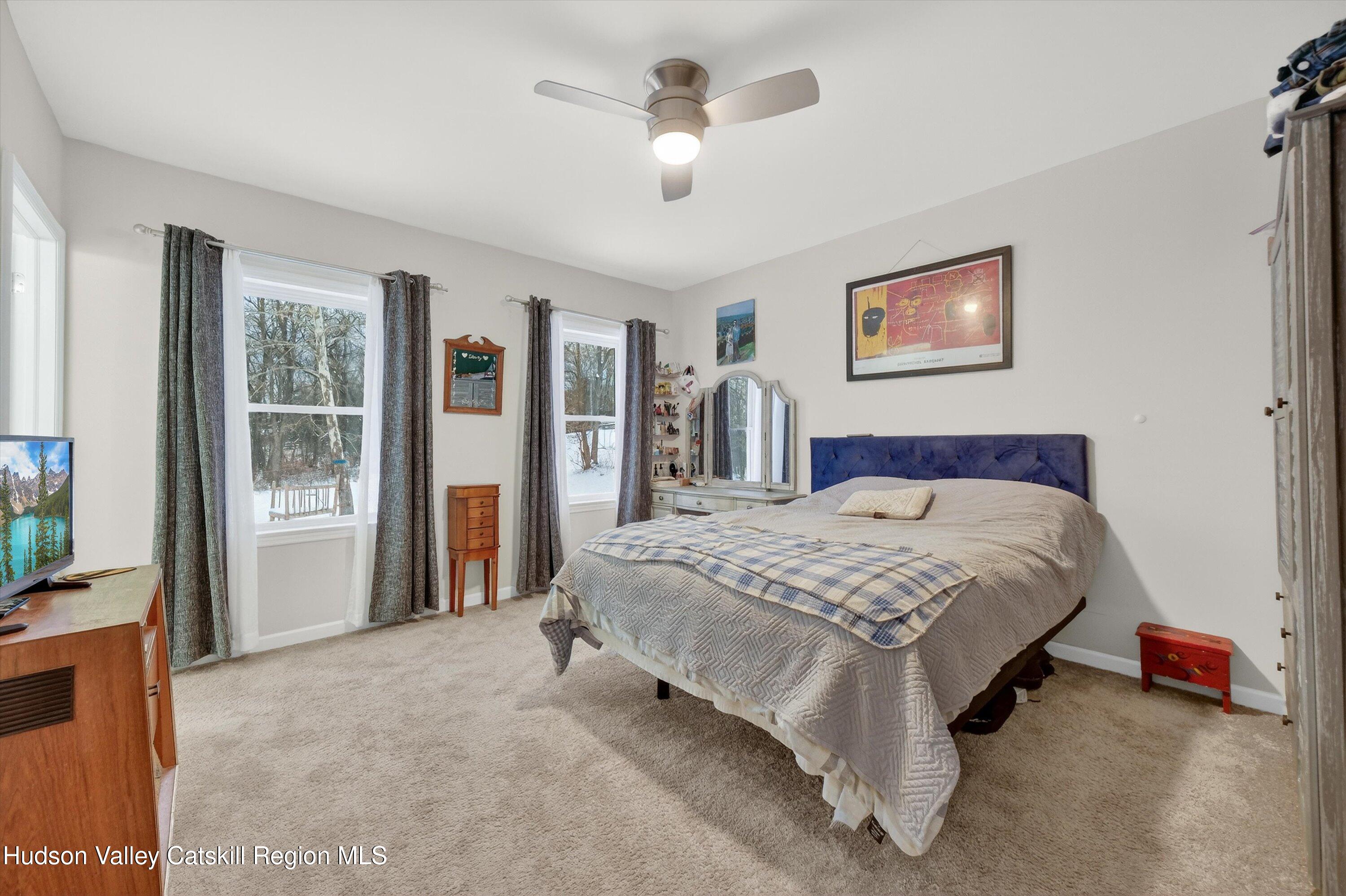 5 3rd Street Milton, NY 12547 - Photo 14 of 31 a bed sitting in a bedroom next to a window