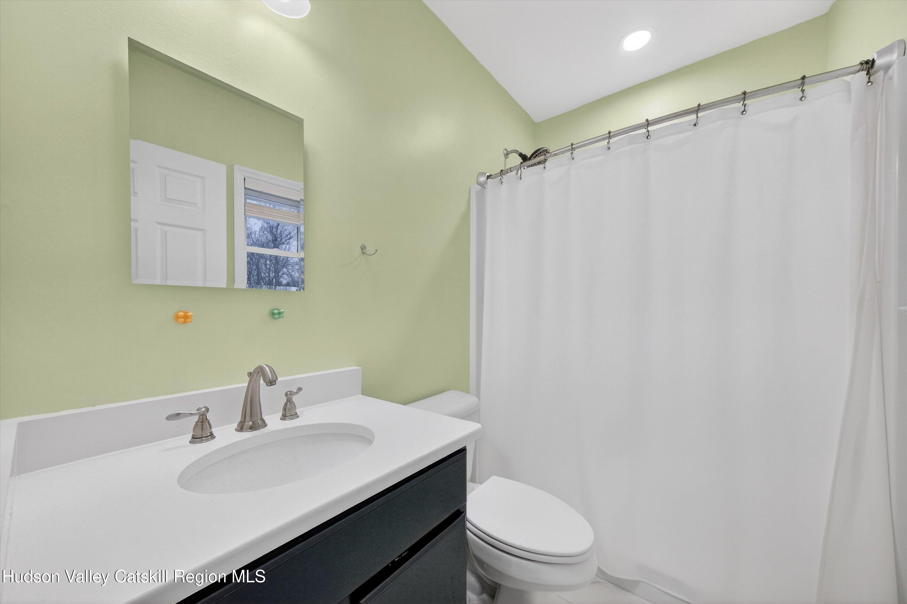 5 3rd Street Milton, NY 12547 - Photo 16 of 31 a bathroom with a sink toilet and a mirror