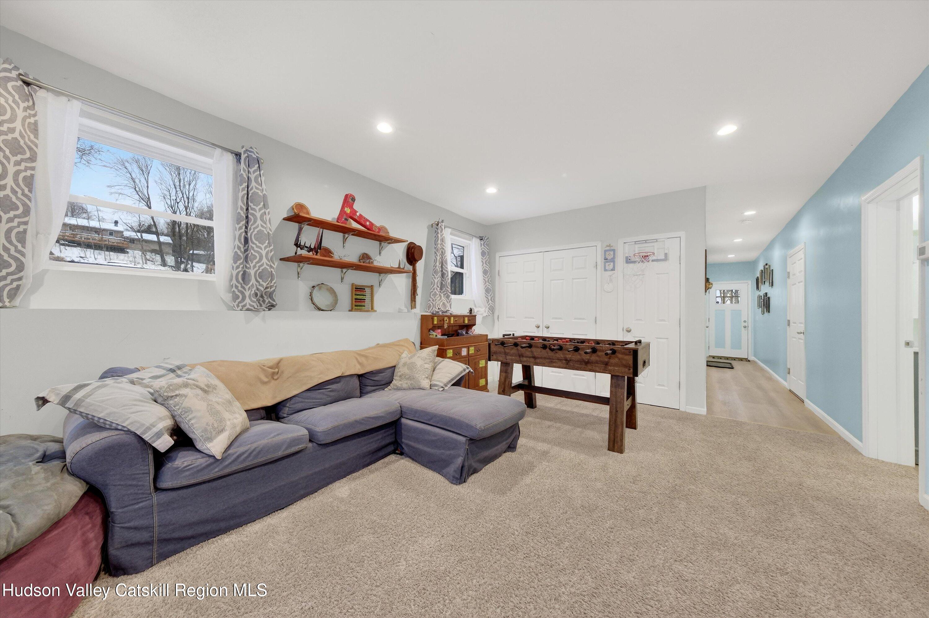 5 3rd Street Milton, NY 12547 - Photo 21 of 31 a living room with furniture and a night stand
