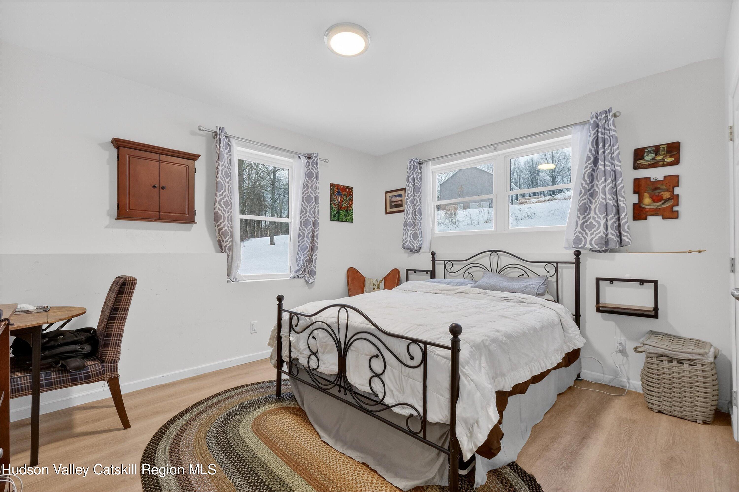 5 3rd Street Milton, NY 12547 - Photo 22 of 31 a bedroom with a bed and a table