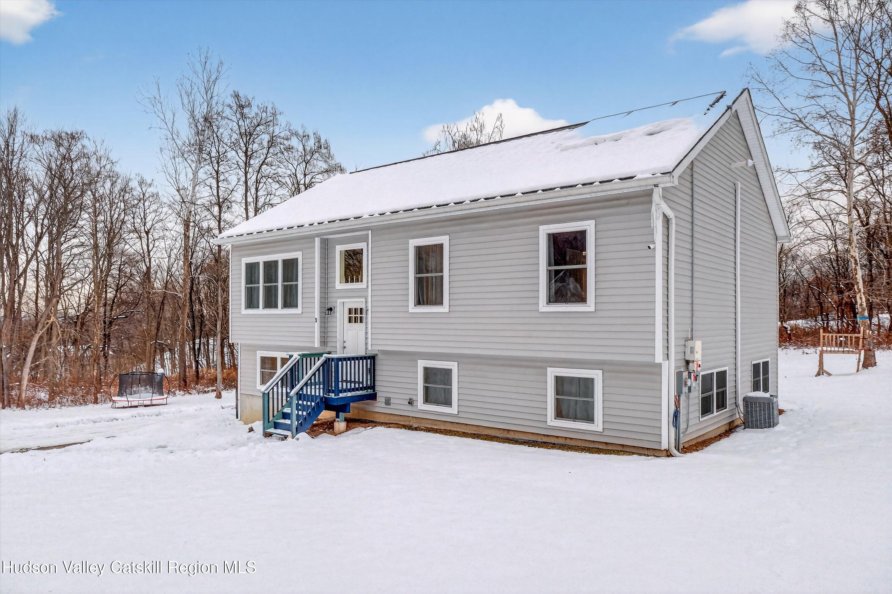 5 3rd Street Milton, NY 12547 - Photo 6 of 31 a view of a house with a barbeque and large trees