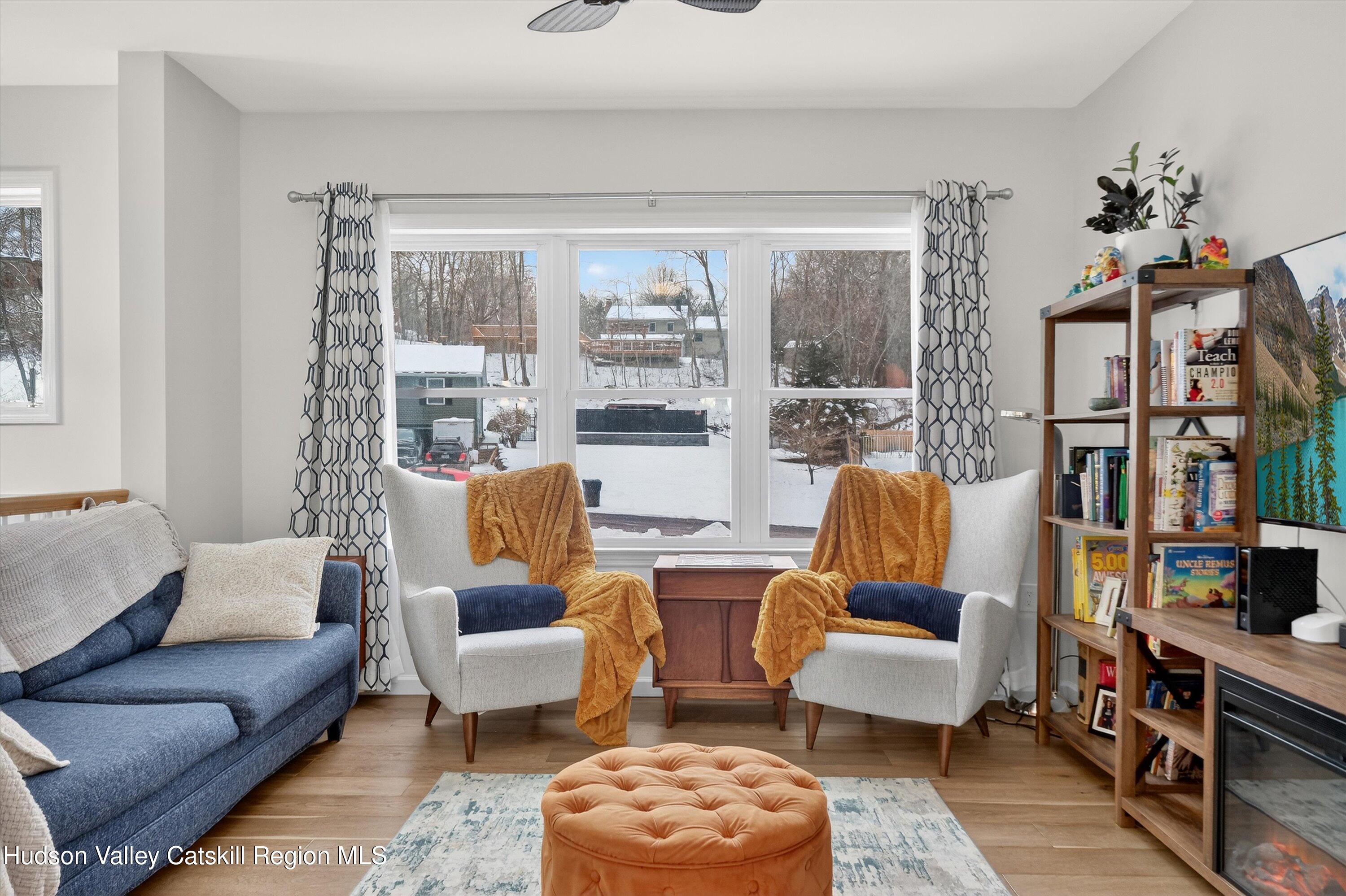 5 3rd Street Milton, NY 12547 - Photo 8 of 31 a living room with furniture and a floor to ceiling window