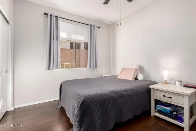 a bedroom with a bed and a tv