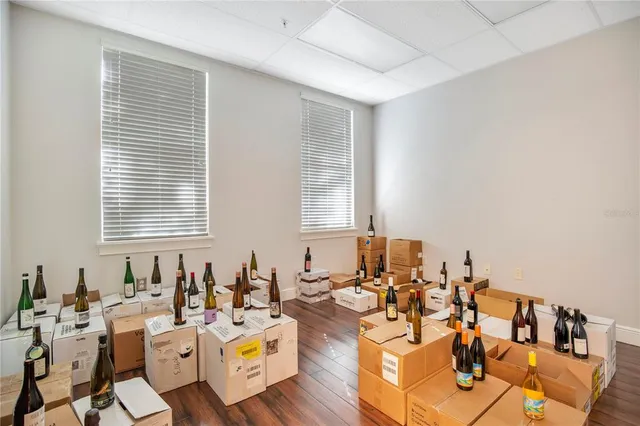 a view of a building with sitting area and furniture